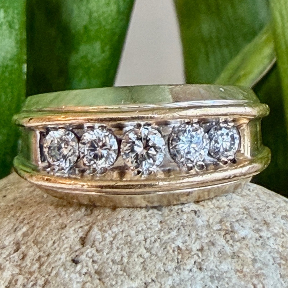 Sold.     Gold and diamond Women's Ring